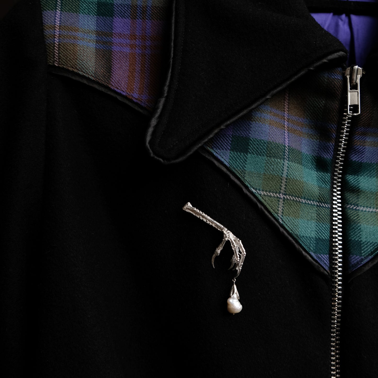 Birds claw talon brooch made in sterling silver with drop freshwater pearl. Made in London by Charlie Shires