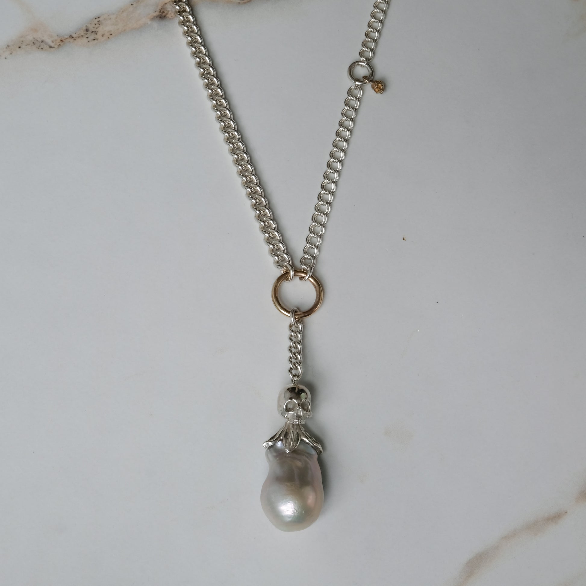 Sterling silver mix-matched curb link chain necklace with 9ct yellow gold jump ring details, old skull and hanging silver and flouish pendant with pearl. Handmade in London by Charlie Shires