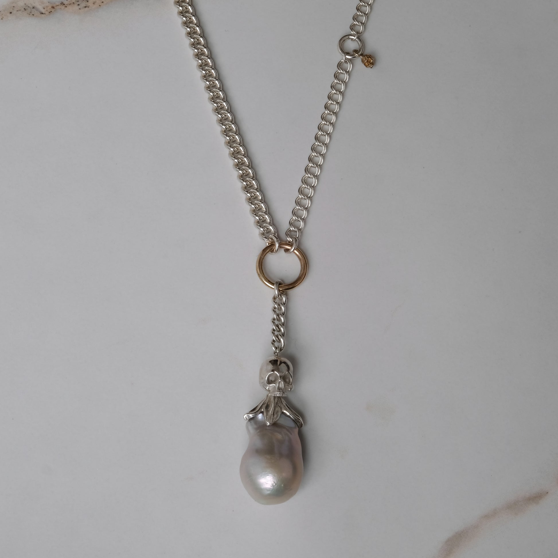 Sterling silver mix-matched curb link chain necklace with 9ct yellow gold jump ring details, old skull and hanging silver and flouish pendant with pearl. Handmade in London by Charlie Shires