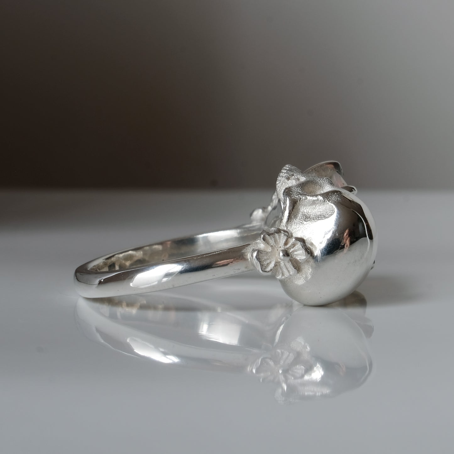 Silver skull and white opal ring with decorative flowers