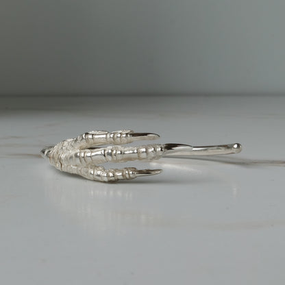 Sterling silver birds claw talon bangle handmade in London by Charlie Shires