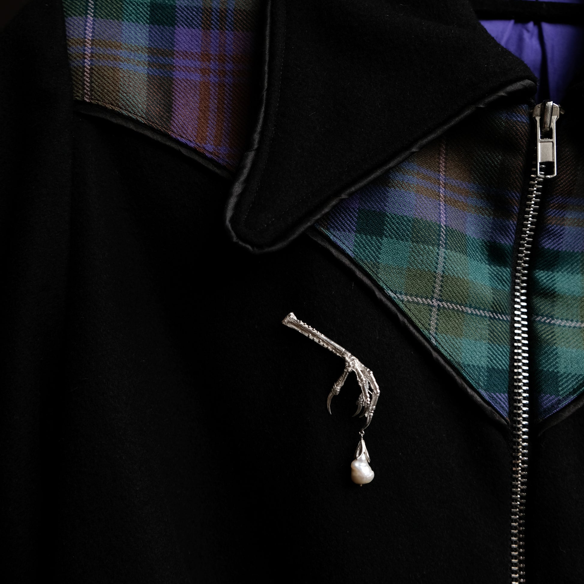 Birds claw talon brooch made in sterling silver with drop freshwater pearl. Made in London by Charlie Shires