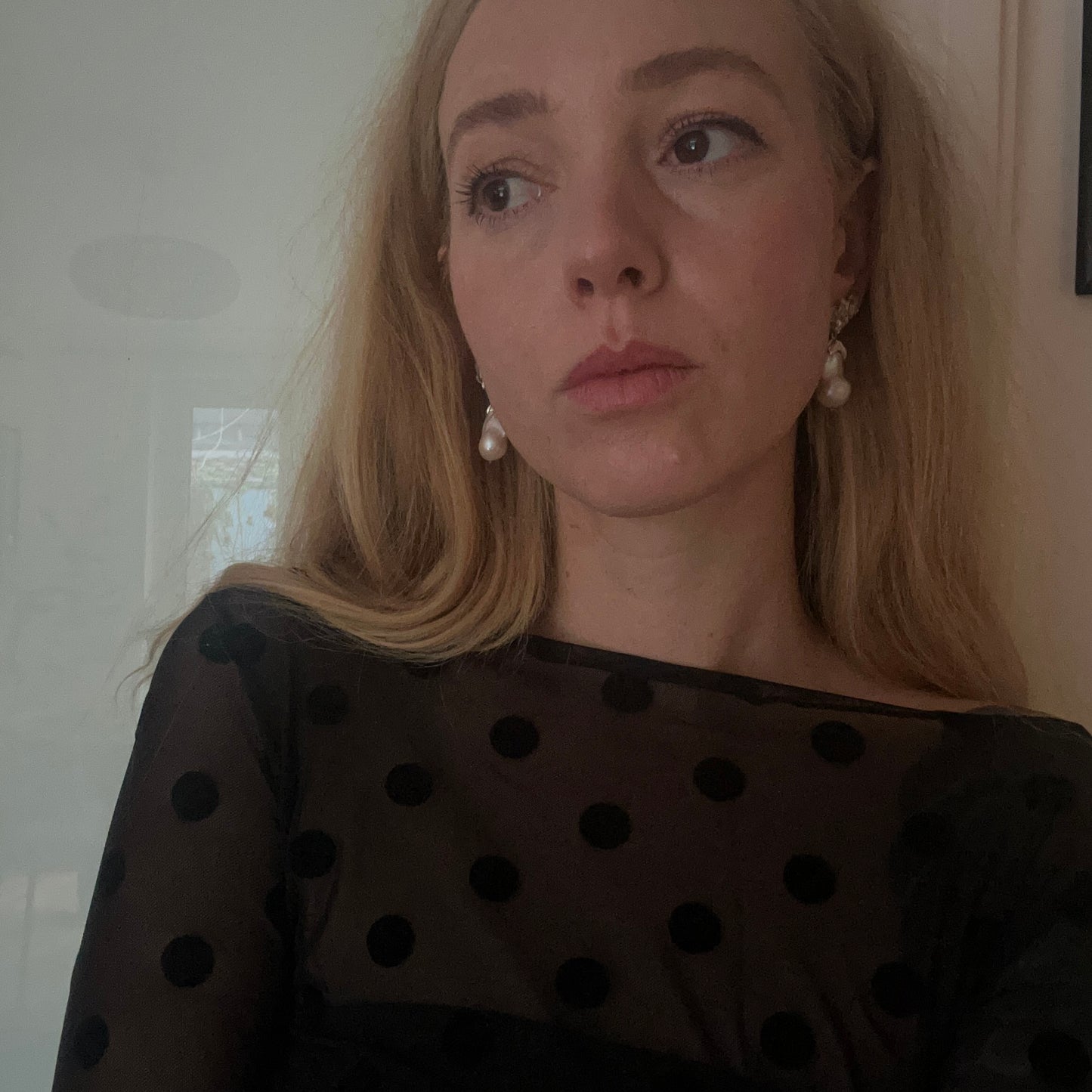 Silver stud earrings with skulls, flowers and baroque pearls. Made in recycled silver in London by Charlie Shires