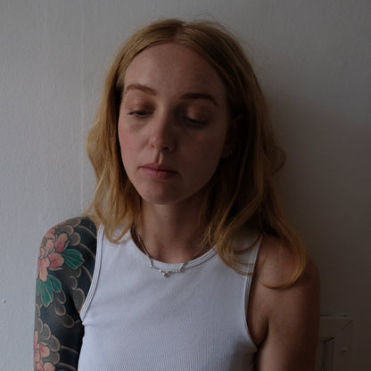 Three bat necklace on curb link chain, made in sterling silver by Charlie Shires in London