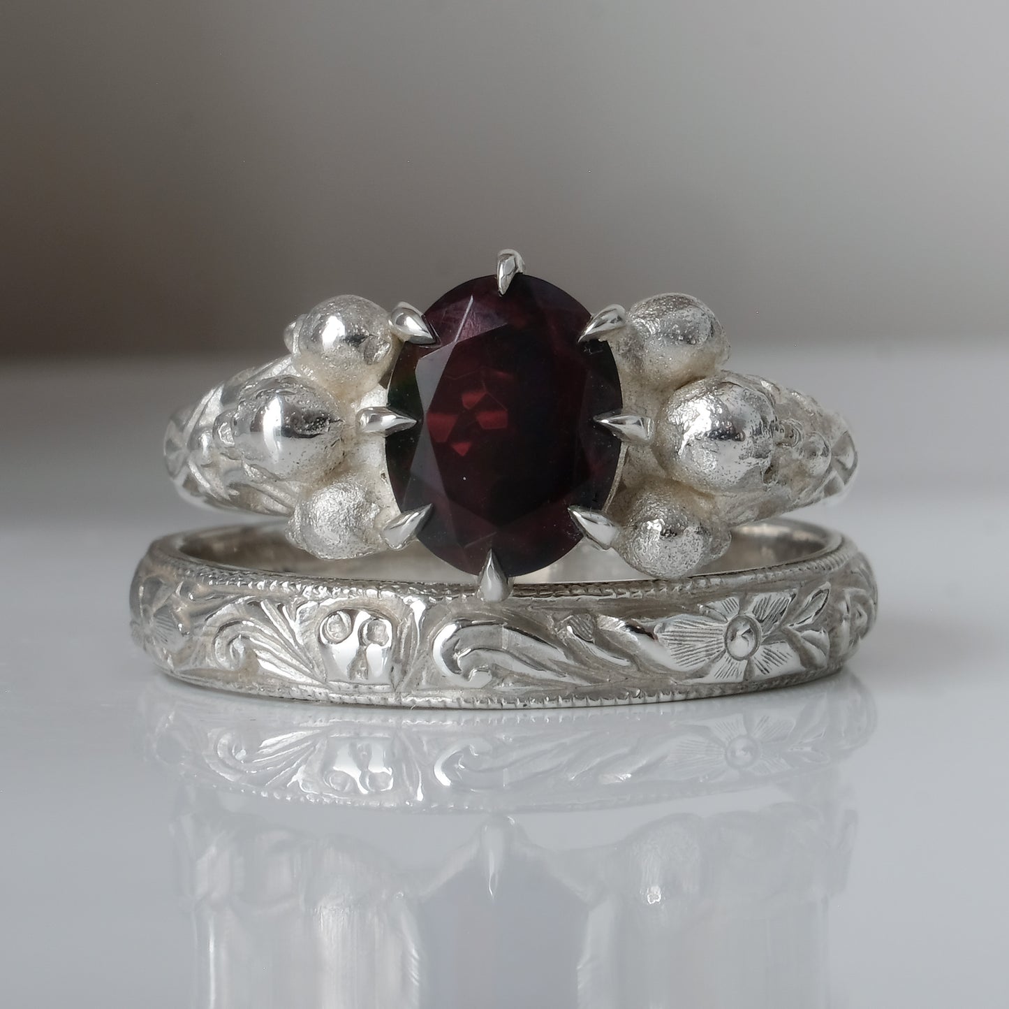 Silver band engraved with skulls, flourishes and flowers by Charlie Shires