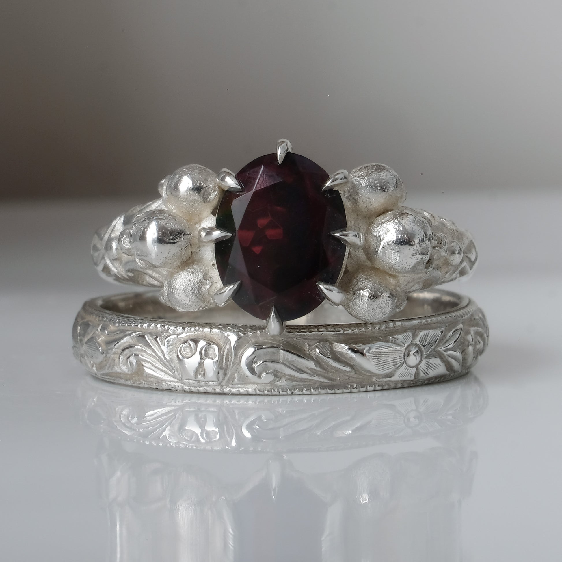 Silver band engraved with skulls, flourishes and flowers by Charlie Shires