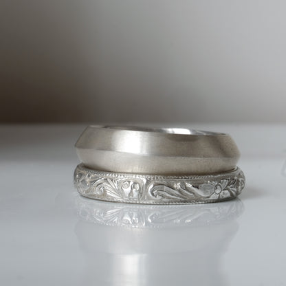 Silver band engraved with skulls, flourishes and flowers by Charlie Shires