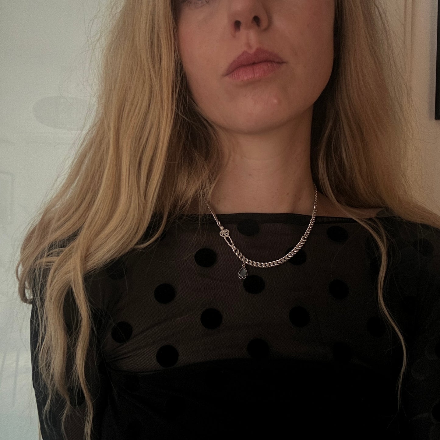 Sterling silver curb link necklace with skeleton and hanging moonstone. Photographed on model. Made in London by Charlie Shires