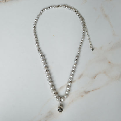 Hand strung grey freshwater pearls with a large sterling silver skull, made by hand in London by Charlie Shires