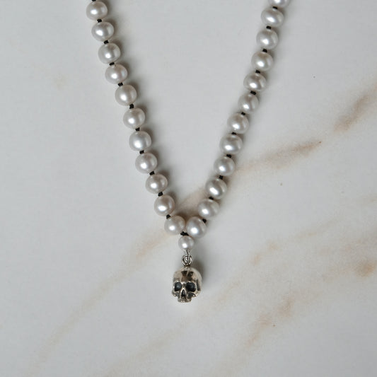 Hand strung grey freshwater pearls with a small sterling silver skull, made by hand in London by Charlie Shires