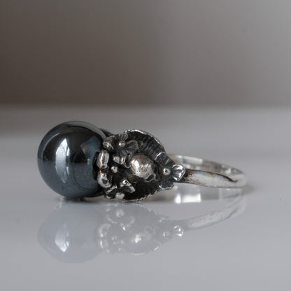 Silver skull and flower hematite ring by Charlie Shires