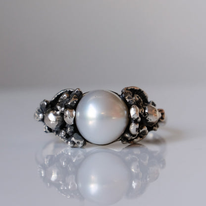 Sterling silver skull and flower pearl ring made in London by Charlie Shires