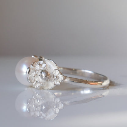 Sterling silver skull and flower pearl ring made in London by Charlie Shires