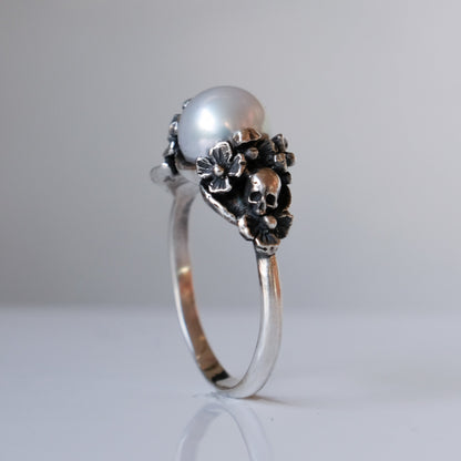 Sterling silver skull and flower pearl ring made in London by Charlie Shires