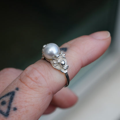 Sterling silver skull and flower pearl ring made in London by Charlie Shires