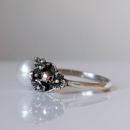 Sterling silver skull and flower pearl ring made in London by Charlie Shires