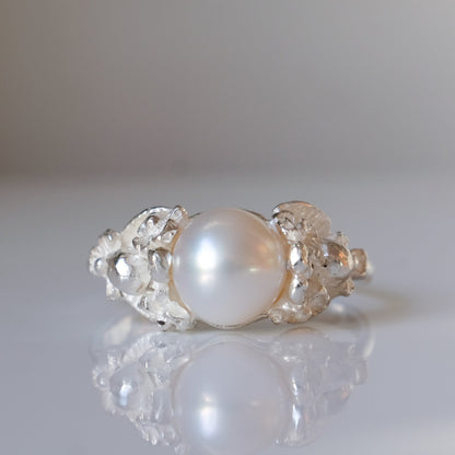 Sterling silver skull and flower pearl ring made in London by Charlie Shires