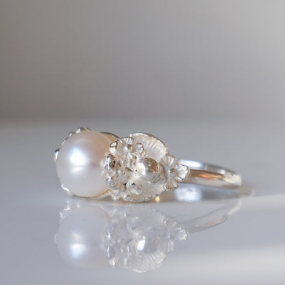 Sterling silver skull and flower pearl ring made in London by Charlie Shires