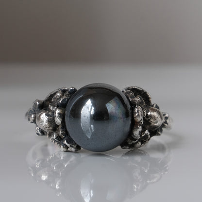 Silver skull and flower hematite ring by Charlie Shires