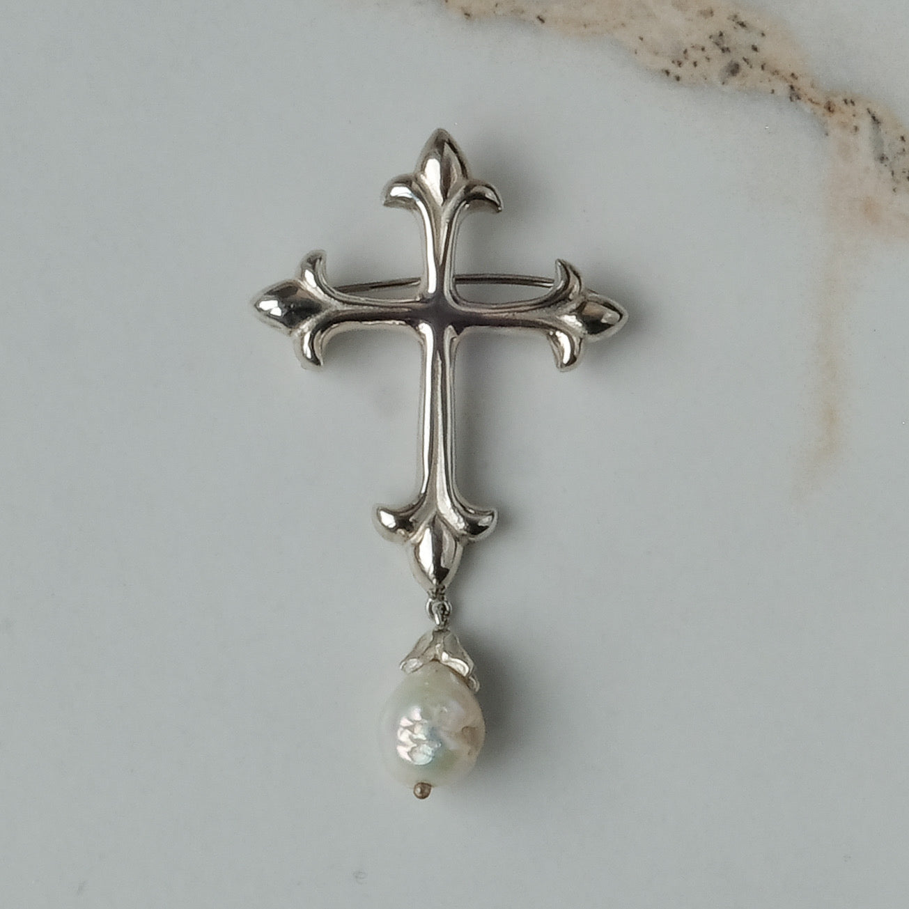 Sterling silver crucifix brooch with drop pearl handmade in London by Charlie Shires