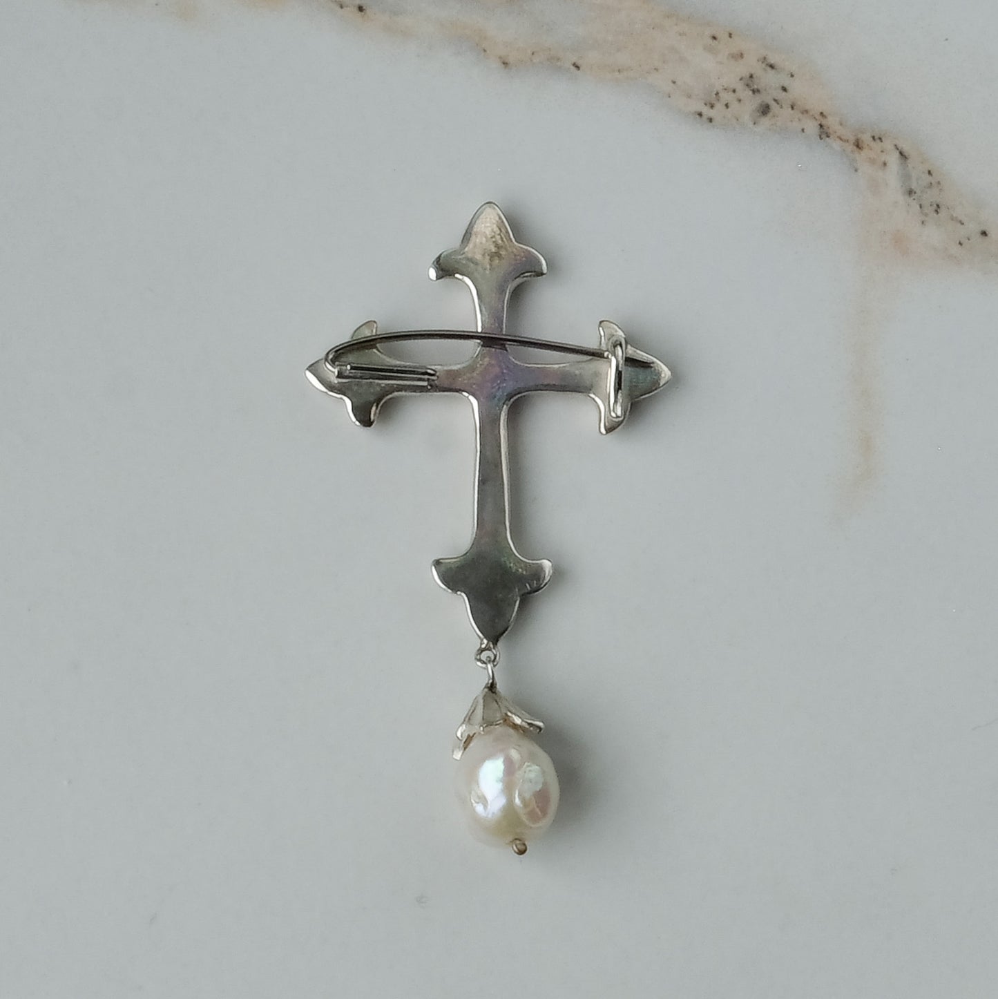 Sterling silver crucifix brooch with drop pearl handmade in London by Charlie Shires