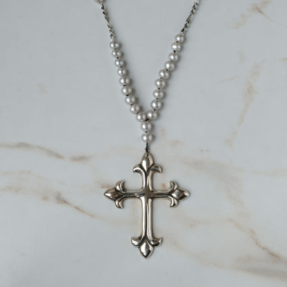 Large crucifix hand strung on a pearl chain. Crucifix is made of Sterling silver by Charlie Shires