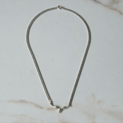 Bat necklace on curb link chain, made in sterling silver by Charlie Shires in London