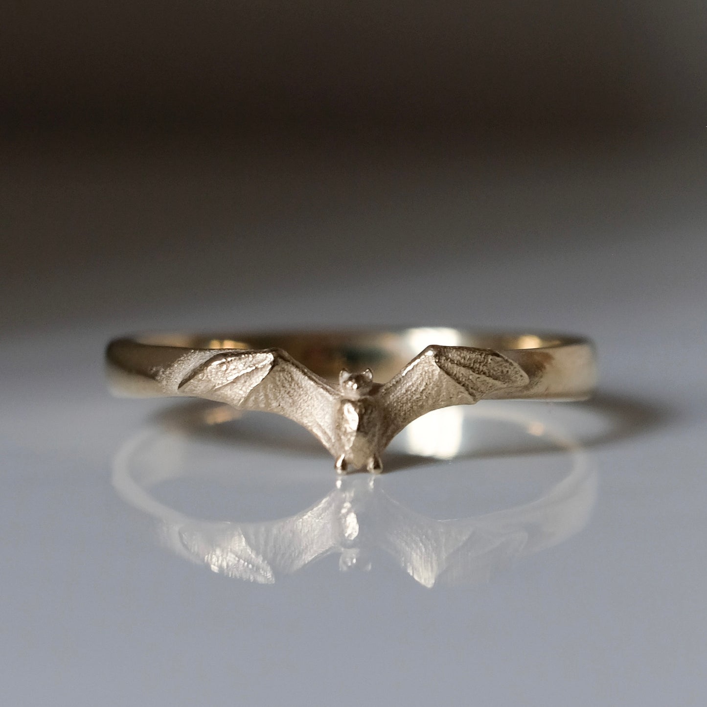 Mina bat ring in 9ct yellow gold. Handmade in London by Charlie Shires