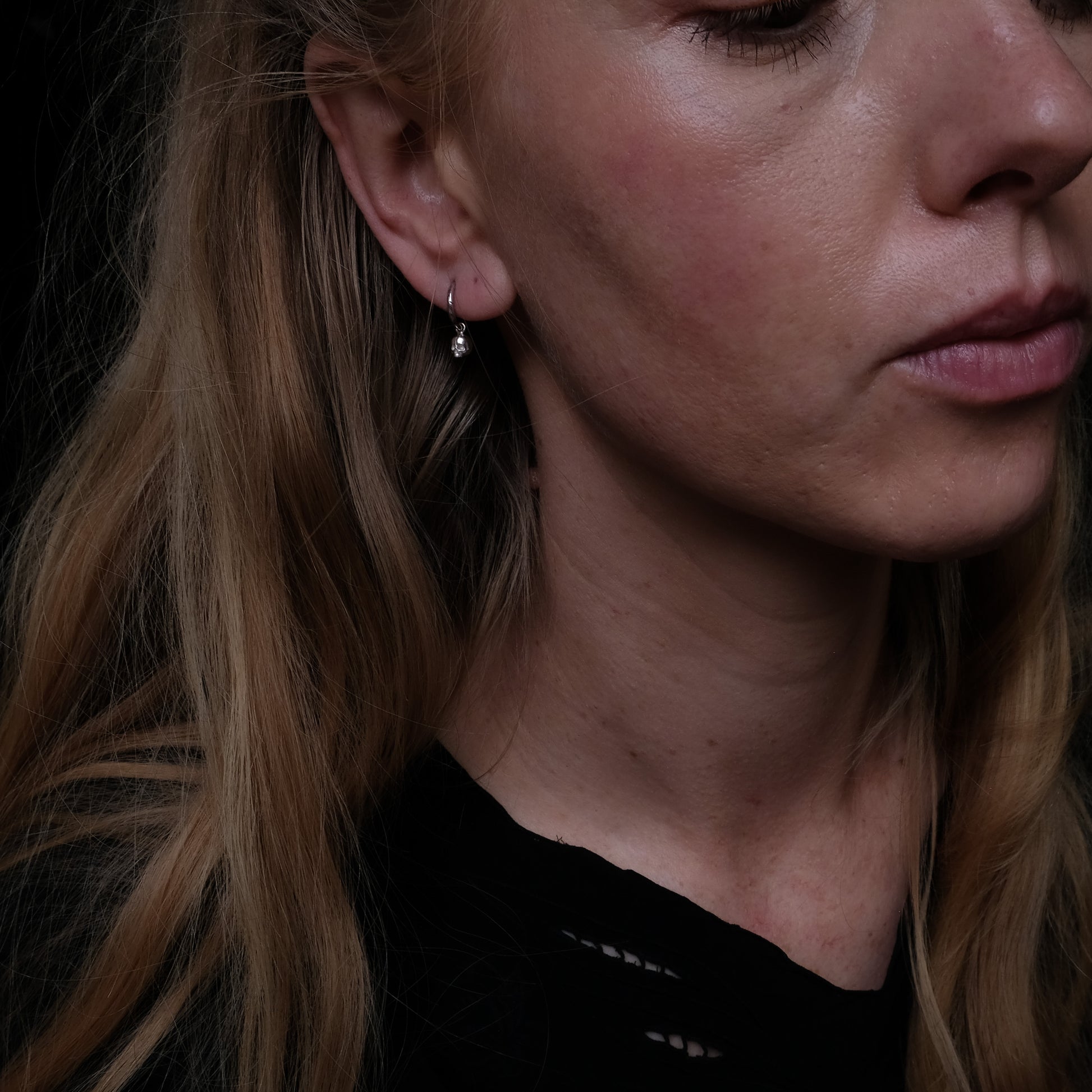 Sterling silver skull huggie hoop earrings made in London by Charlie Shires