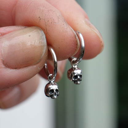 Sterling silver skull huggie hoop earrings made in London by Charlie Shires