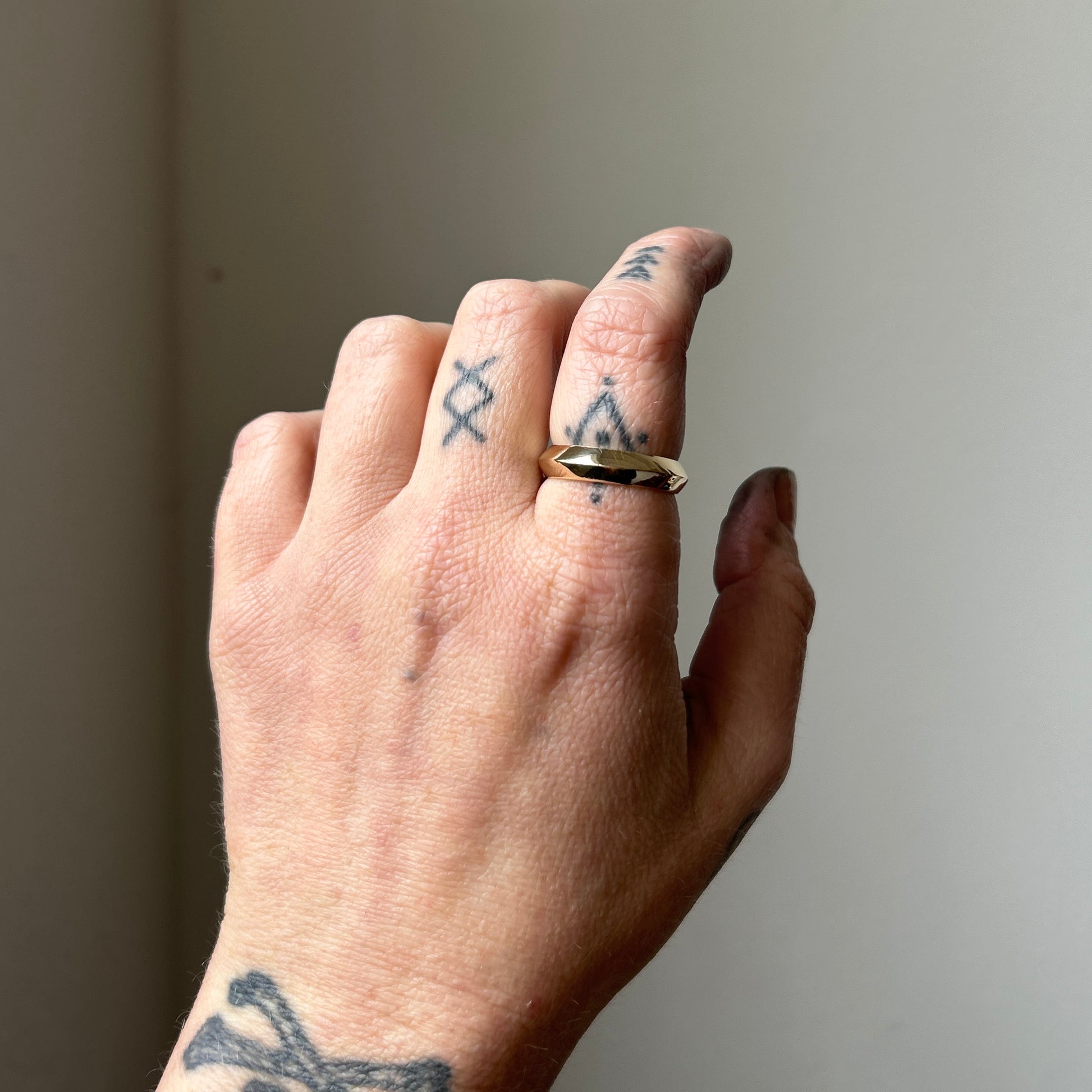 Knife edge gold mens wedding band. 9ct yellow gold, handmade in London by Charlie Shires
