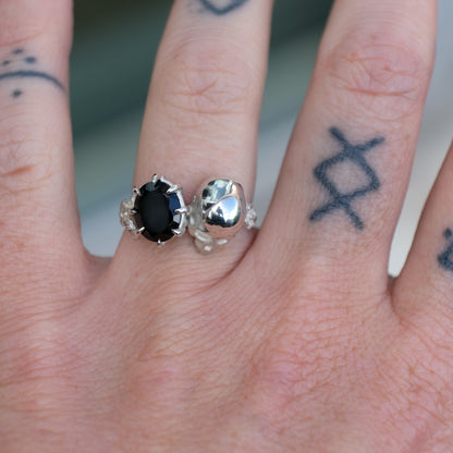Silver skull and black spinel ring with decorative flowers by Charlie Shires jewellery