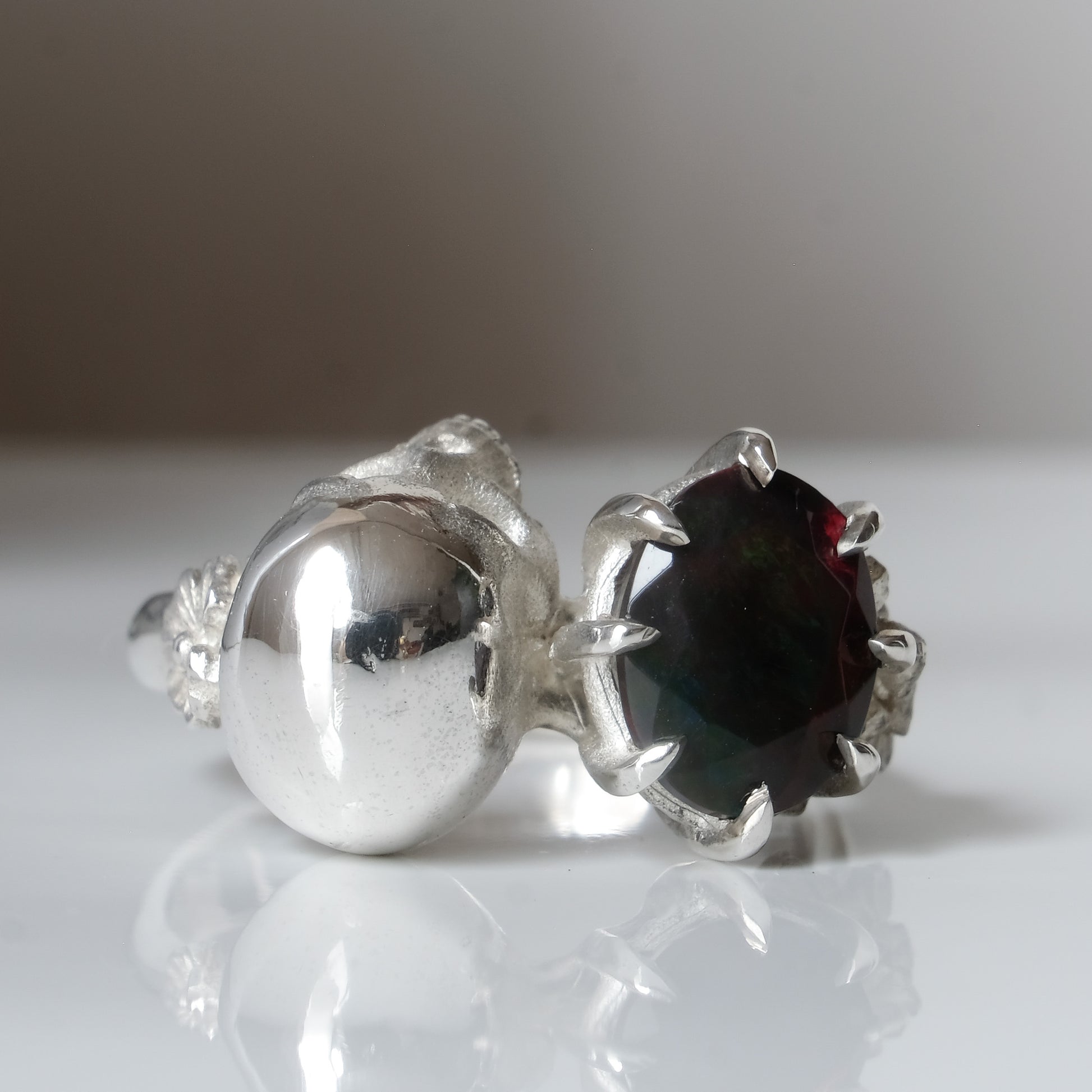 Silver skull and black opal ring with decorative flowers by Charlie Shires jewellery