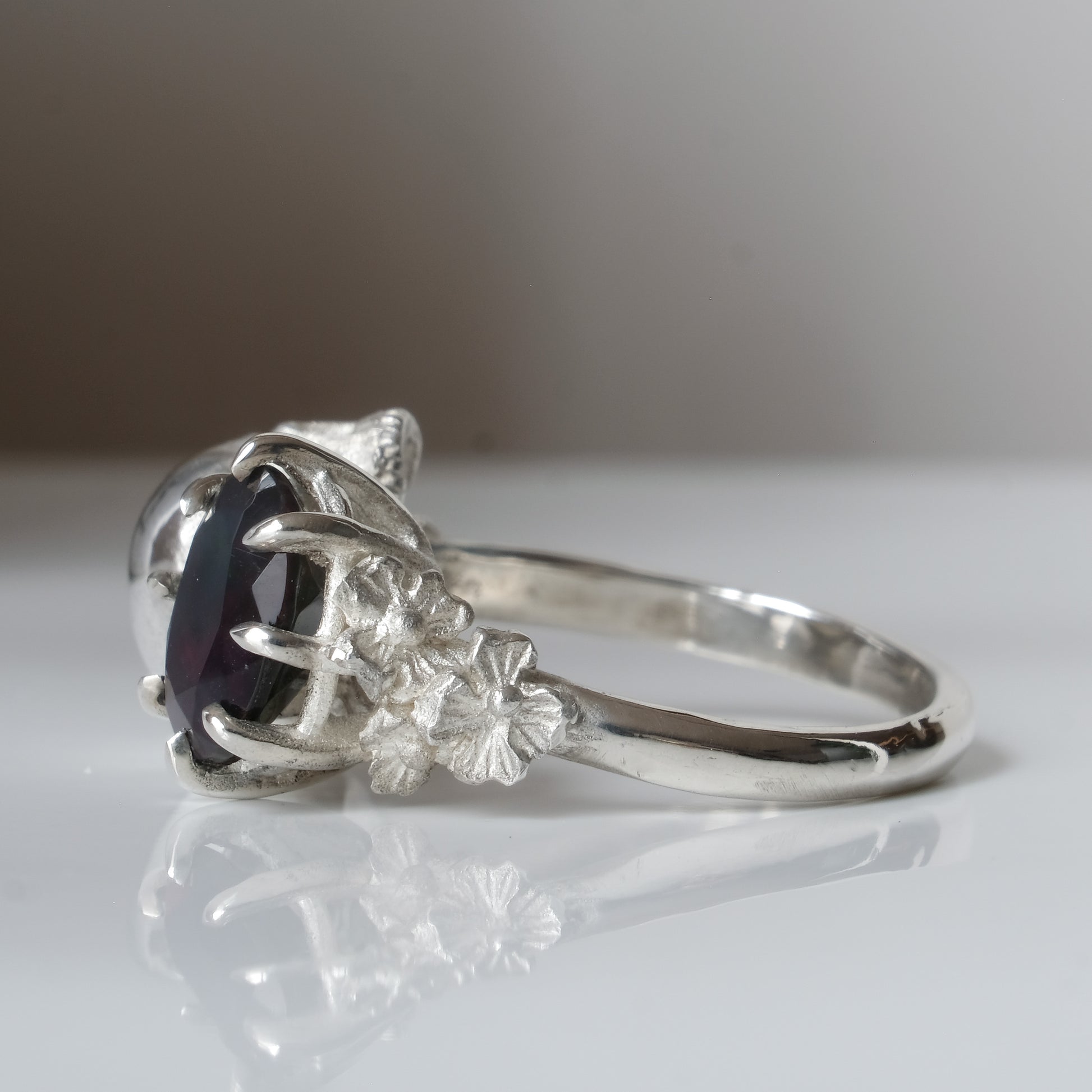 Silver skull and black opal ring with decorative flowers by Charlie Shires jewellery