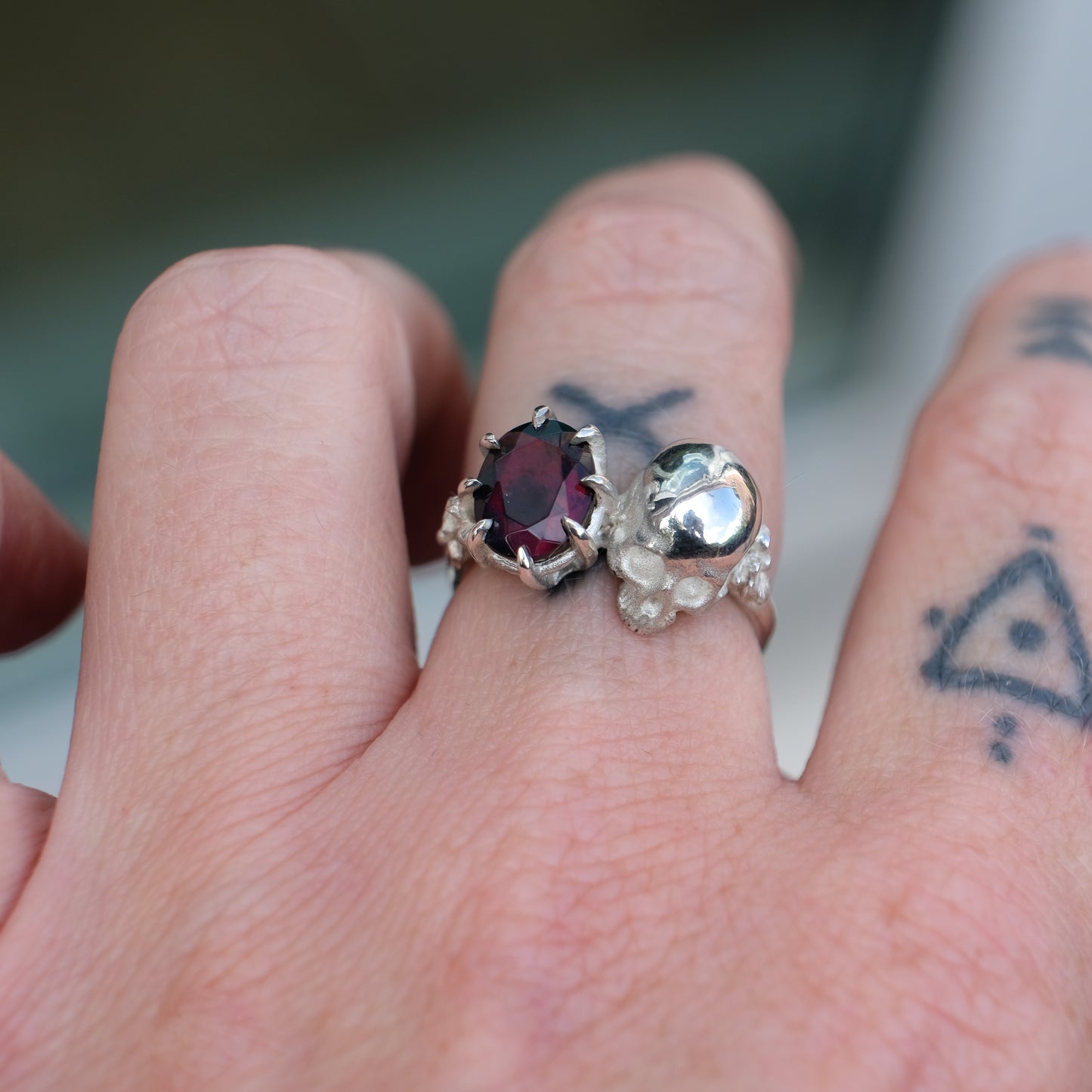 Silver skull and black opal ring with decorative flowers by Charlie Shires jewellery