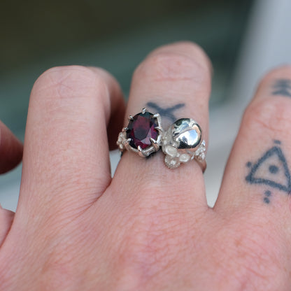 Silver skull and black opal ring with decorative flowers by Charlie Shires jewellery