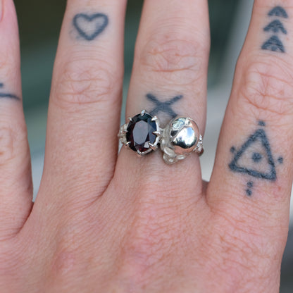 Silver skull and black opal ring with decorative flowers by Charlie Shires jewellery