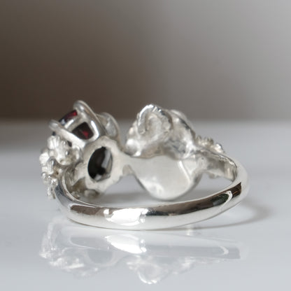 Silver skull and black opal ring with decorative flowers by Charlie Shires jewellery