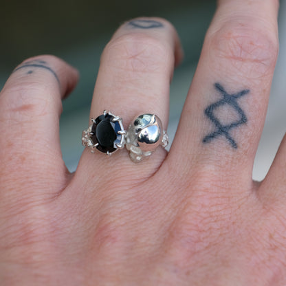 Silver skull and black spinel ring with decorative flowers by Charlie Shires jewellery