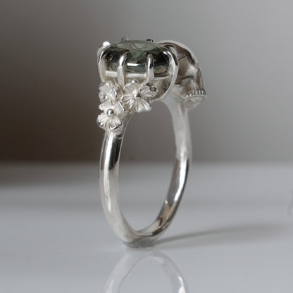 Silver skull and synthetic tourmaline ring with decorative flowers