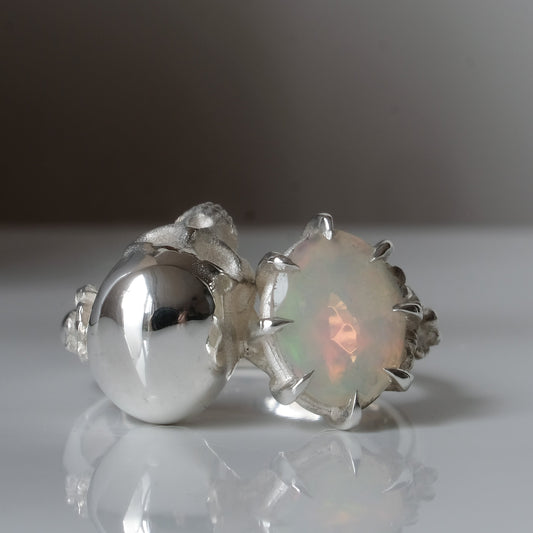 Silver skull and white opal ring with decorative flowers