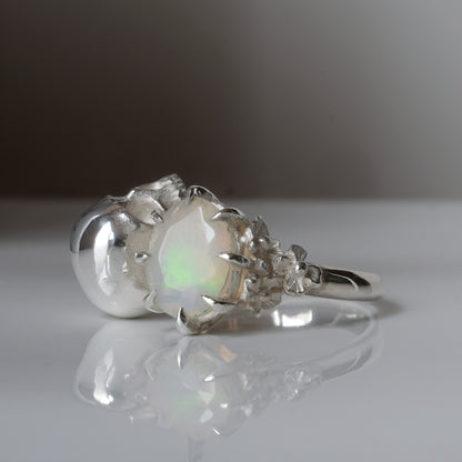 Silver skull and white opal ring with decorative flowers