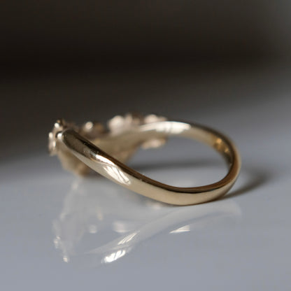 Wishbone shaped stack ring decorated with flowers and leaves. Made in London in 9ct yellow gold by Charlie Shires